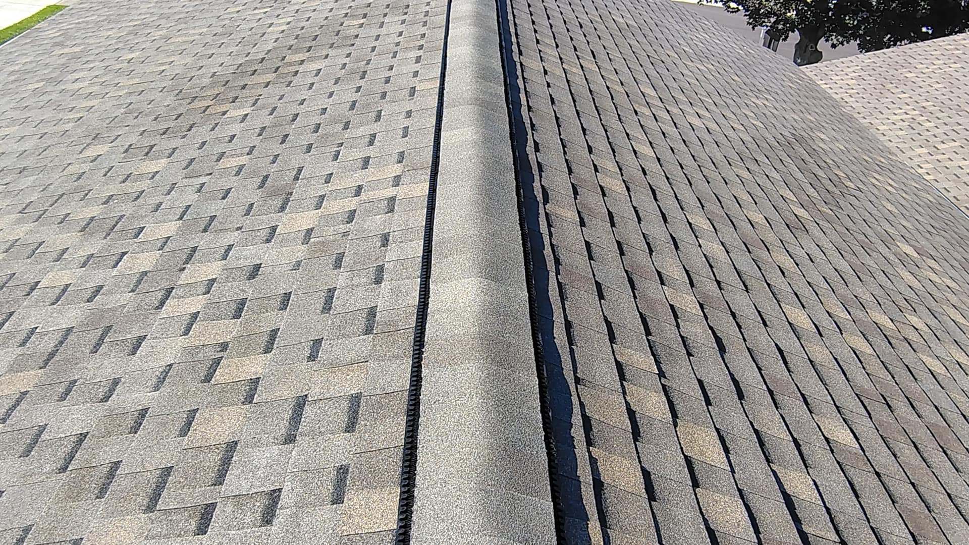 Completed shingle roof with ridge vent installed by Adriana Roofing LLC